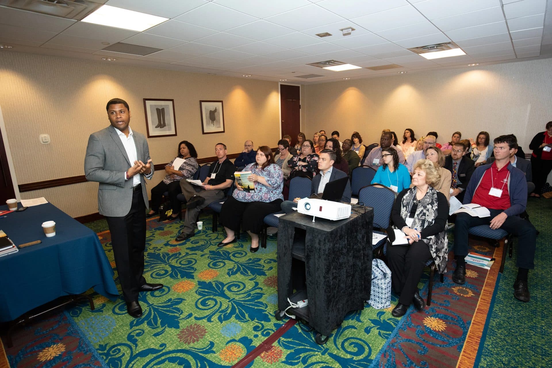 A presenter speaking to a seated audience during a Rural Summit breakout session
