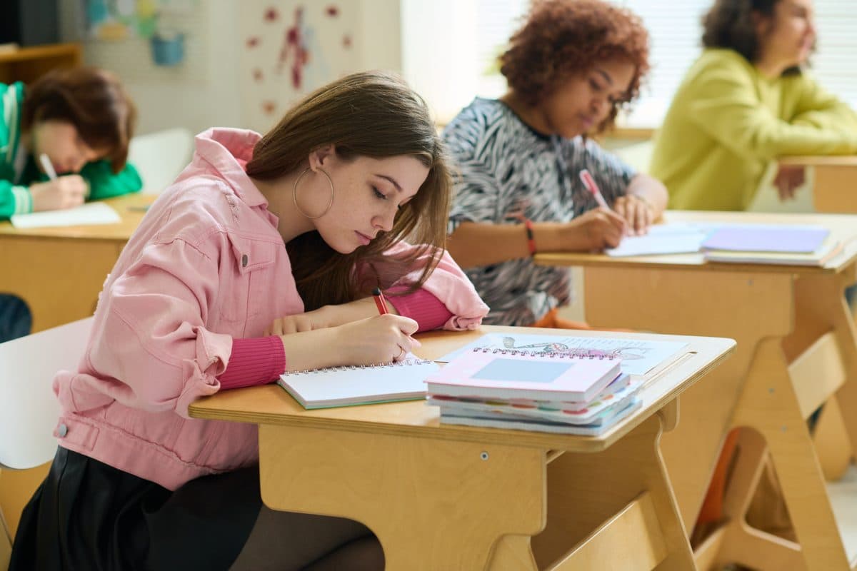 Student taking notes in class